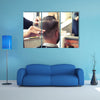 Back view of Man in Barber shop Barber Cutting Hair with Scissors Multi Panel Canvas Wall Art