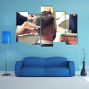 Back view of Man in Barber shop Barber Cutting Hair with Scissors Multi Panel Canvas Wall Art