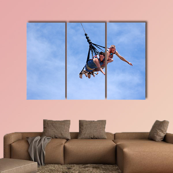 Mature couple rids on SkyCoaster in Wet'n'Wild Gold Coast water park Multi panel canvas wall art
