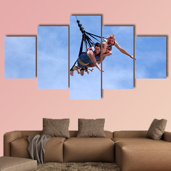 Mature couple rids on SkyCoaster in Wet'n'Wild Gold Coast water park Multi panel canvas wall art