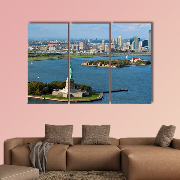 An aerial view from a helicopter of the Statue of Liberty multi panel canvas wall art