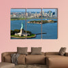 An aerial view from a helicopter of the Statue in New York multi panel canvas wall art