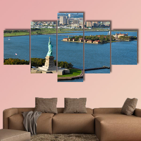 An aerial view from a helicopter of the Statue of Liberty multi panel canvas wall art