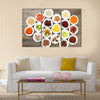 Different products on saucers on wooden table, top view, Multi panel canvas wall art