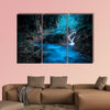 Mystery night at the deep tropical rain forest with flowing cascade waterfall multi panel canvas wall art