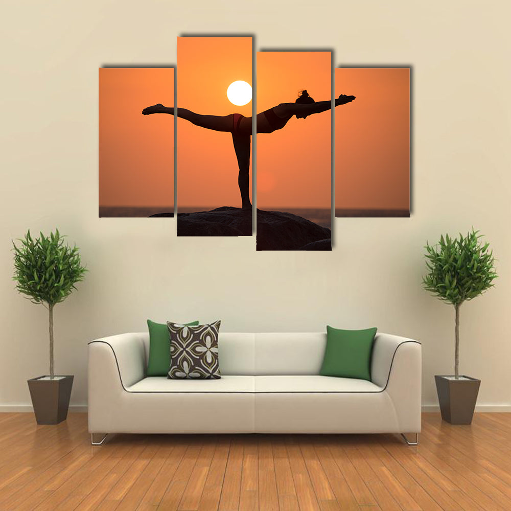 Warrior pose from yoga by woman silhouette on sunset Multi panel canvas wall art