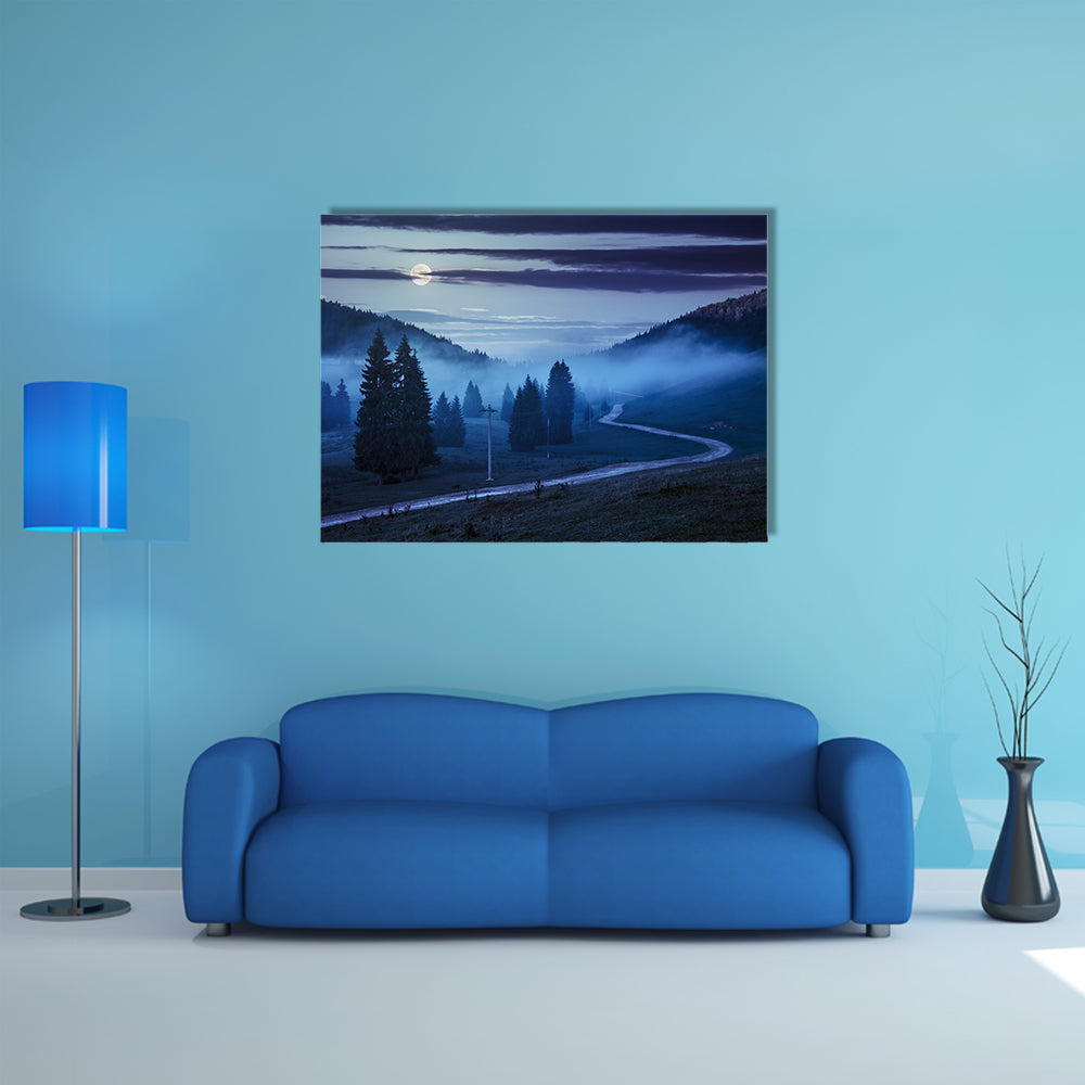 The Road On Through The Meadow Near Few Fir Trees And Forest in foggy mountains Multi Panel Canvas Wall Art