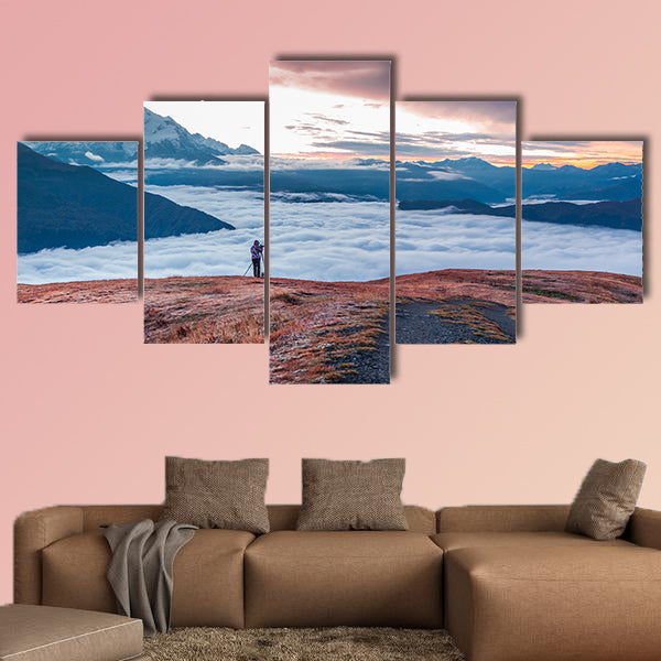Photographer takes a picture at early foggy morning wall art