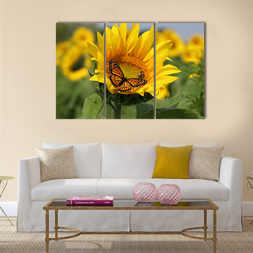 Monarch and a bee on a sunflower Multi Panel Canvas Wall Art