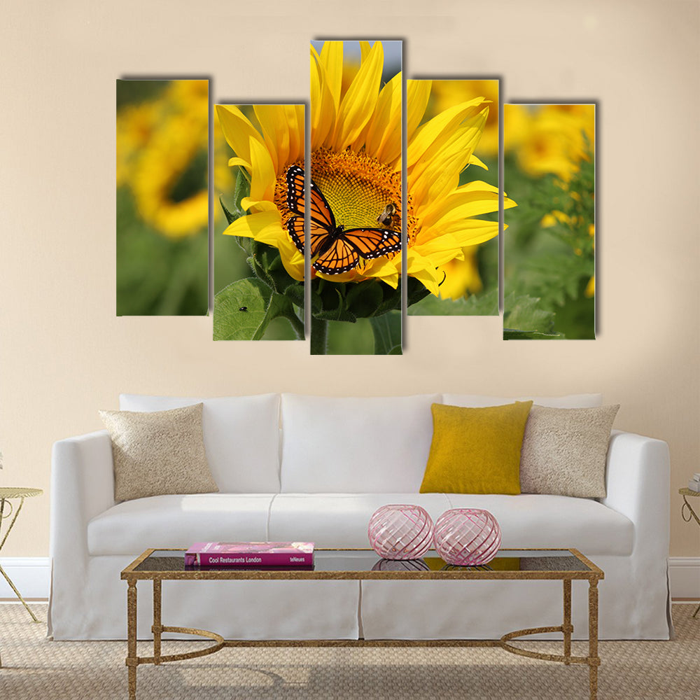 Monarch and a bee on a sunflower Multi Panel Canvas Wall Art
