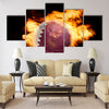 Football ball with the national flag of qatar on fire on a black Multi panel canvas wall art