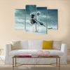 Ice hockey player in outdoor mountains Multi panel canvas wall art