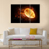 Bright flamy symbol on the black background Multi panel canvas wall art