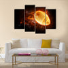 Bright flamy symbol on the black background Multi panel canvas wall art