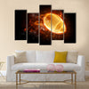 Bright flamy symbol on the black background Multi panel canvas wall art