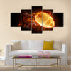 Bright flamy symbol on the black background Multi panel canvas wall art