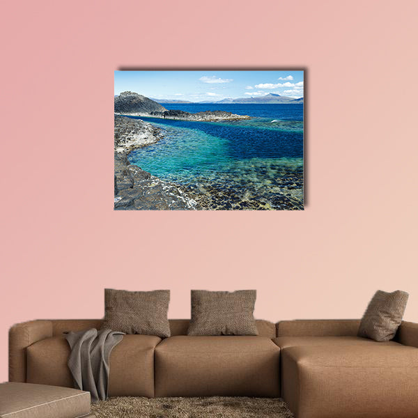 Black rock with the turquoise blue water of the sea at Staffa wall art