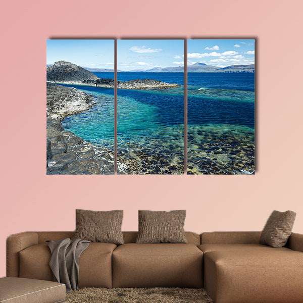 Black rock with the turquoise blue water of the sea at Staffa wall art