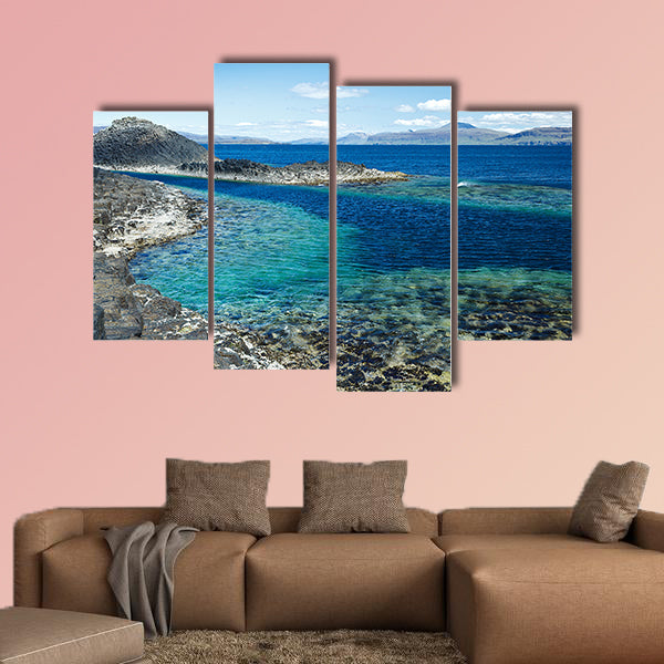 Black rock with the turquoise blue water of the sea at Staffa wall art