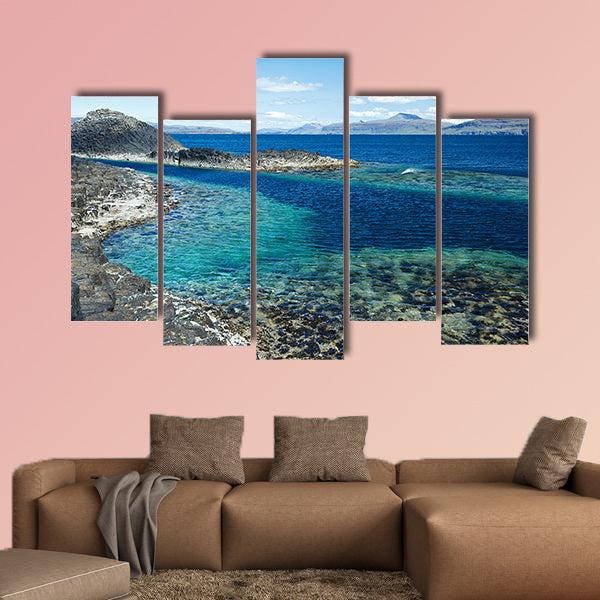 Black rock with the turquoise blue water of the sea at Staffa wall art