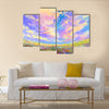 Colorful flowers in field under beautiful clouds Multi Panel Canvas Wall Art