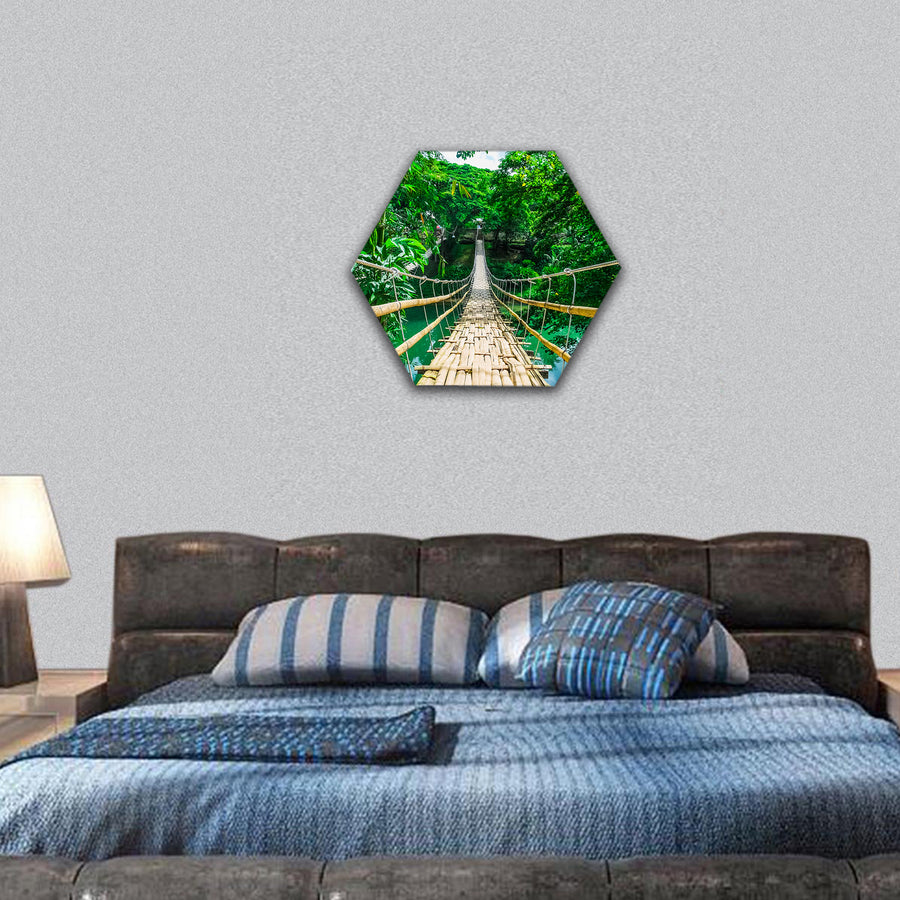 Bamboo pedestrian suspension bridge over river in forest hexagonal canvas wall art