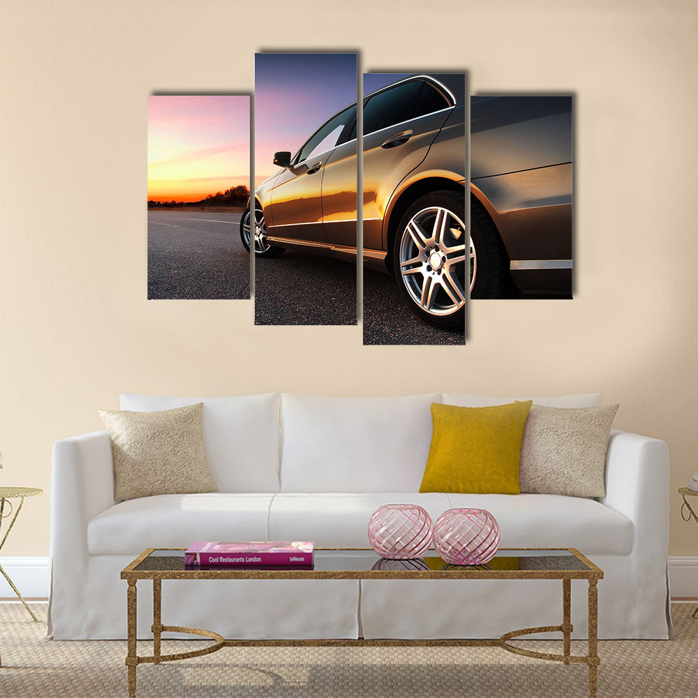 Rear-side view of a luxury car on sunset Multi panel canvas wall art