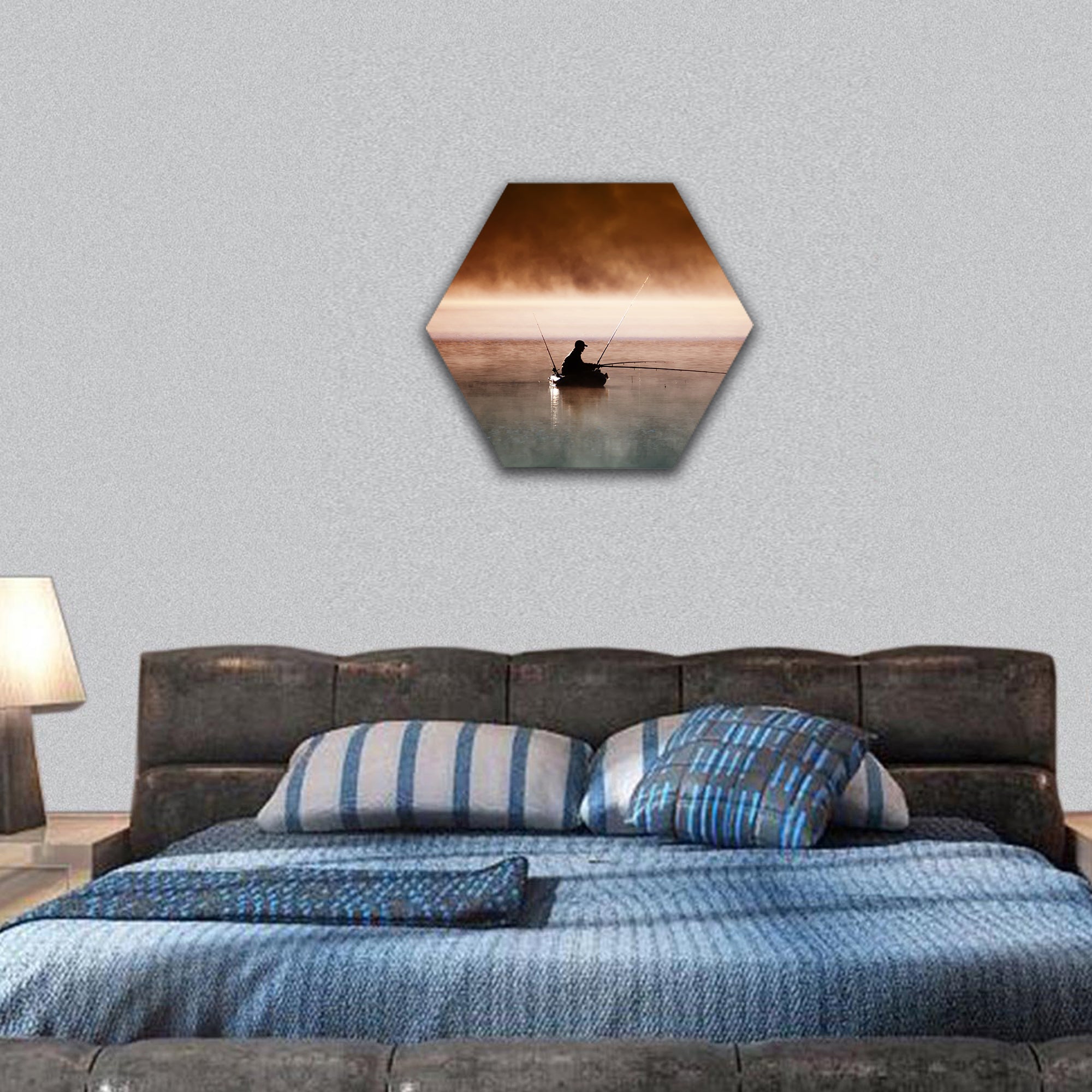 A fisherman sits in boat and catches fish hexagonal canvas wall art