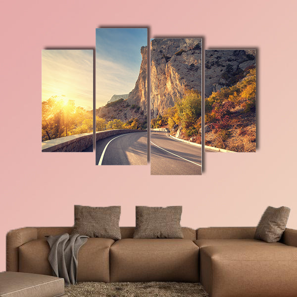Asphalt road in autumn forest at sunrise multi panel canvas wall art