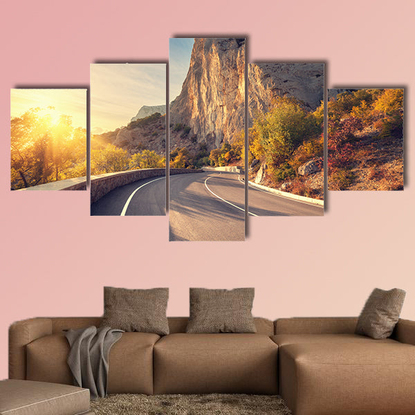 Asphalt road in autumn forest at sunrise multi panel canvas wall art