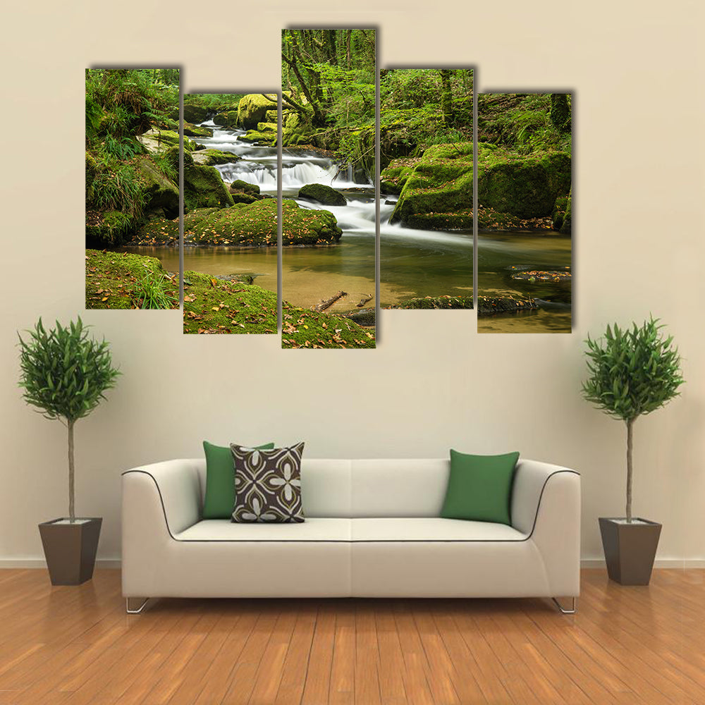Landscape canvas of river flowing through lush green forest in Summer multi panel canvas wall art