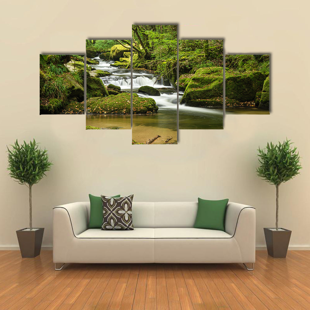 Landscape canvas of river flowing through lush green forest in Summer multi panel canvas wall art