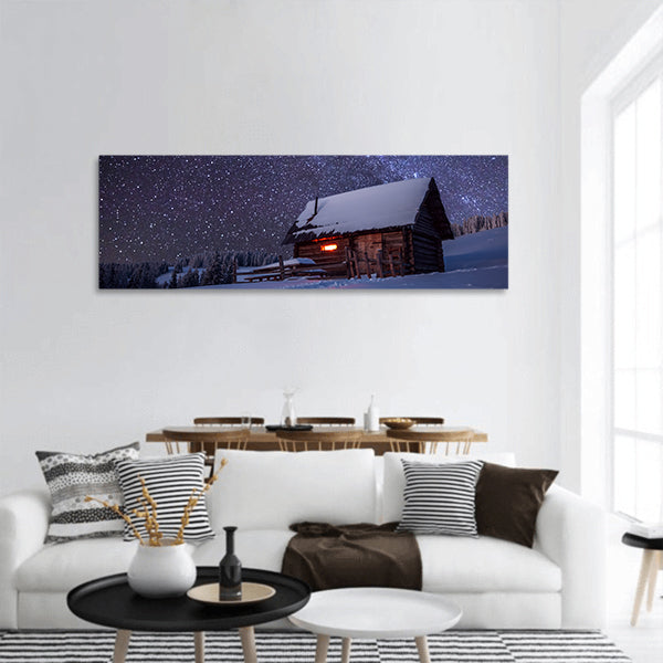 Wooden house in winter forest panoramic canvas wall art.