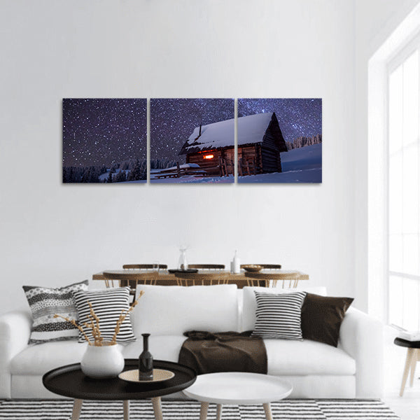 Wooden house in winter forest panoramic canvas wall art.