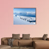 A group of people randonee ski walking high above the fjords. Lyngen Alps, Norway Multi panel canvas wall art