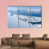 A group of people randonee ski walking high above the fjords. Lyngen Alps, Norway Multi panel canvas wall art