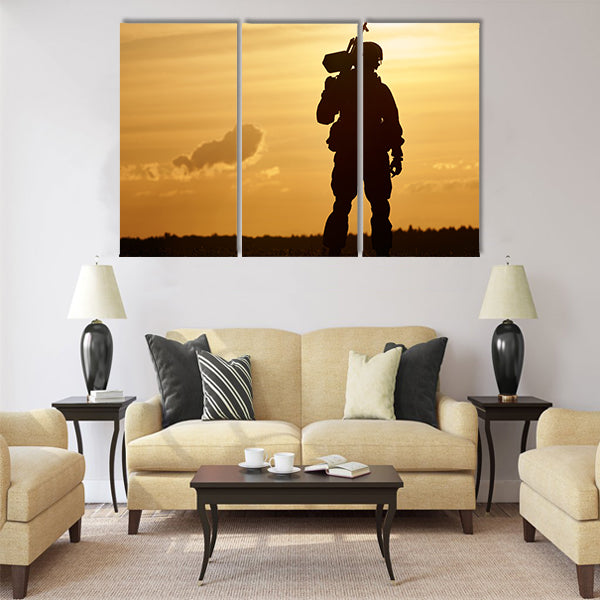 soldier silhouette in uniform with machine gun or assault rifle sunset board multi panel canvas wall art