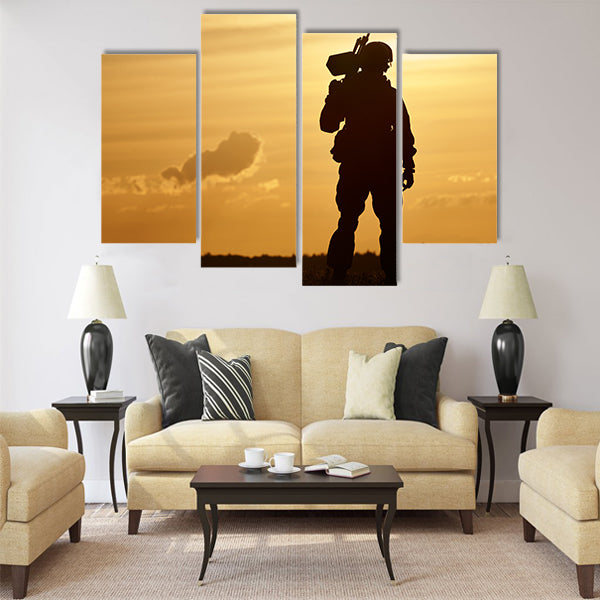soldier silhouette in uniform with machine gun or assault rifle sunset board multi panel canvas wall art
