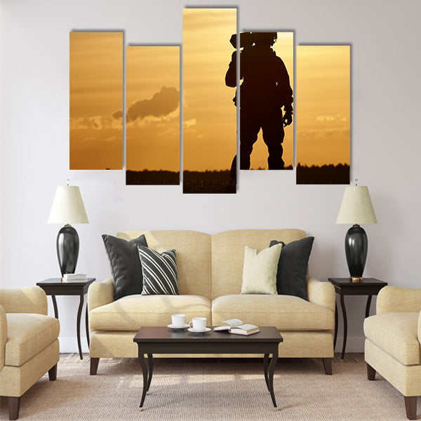 soldier silhouette in uniform with machine gun or assault rifle sunset board multi panel canvas wall art