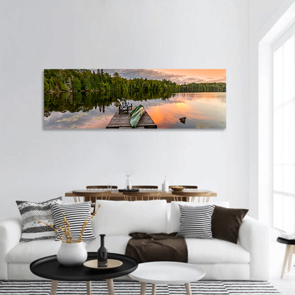 Green Canoe and Chairs on a Dock panoramic canvas wall art.