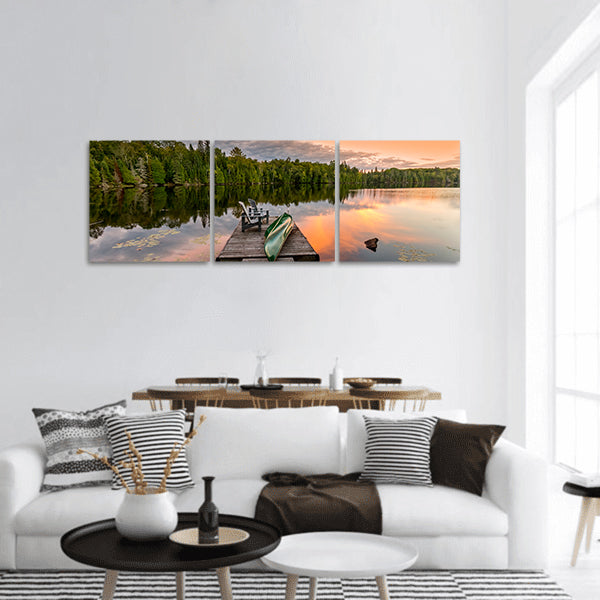 Green Canoe and Chairs on a Dock panoramic canvas wall art.