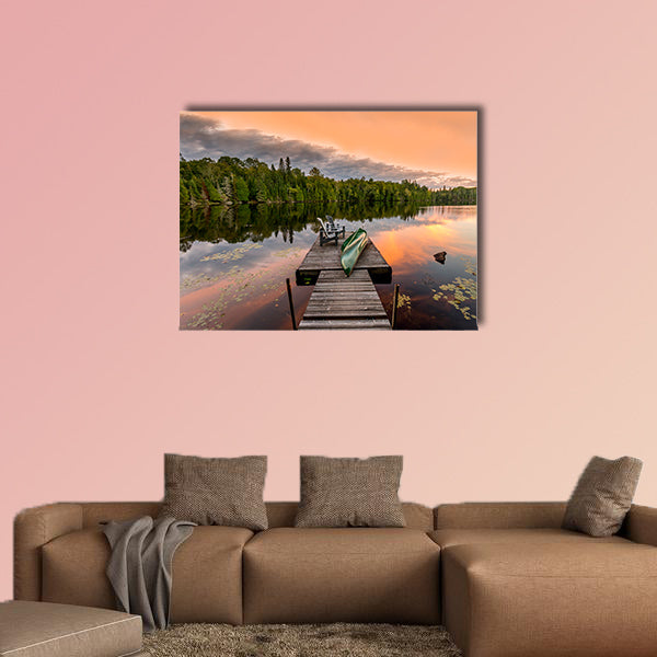 Green Canoe and Chairs on a Dock Next to a Lake at Sunset wall art