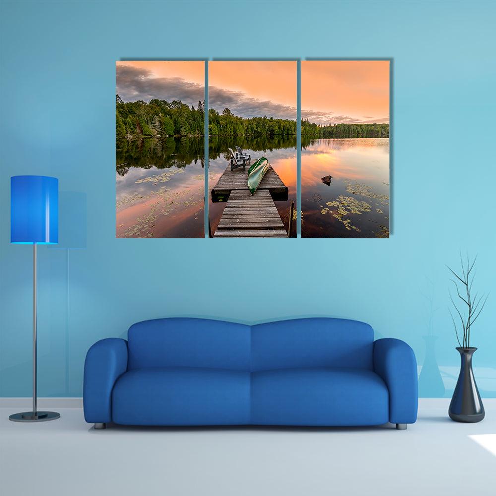 Green Canoe and Chairs on a Dock Next to a Lake at Sunset - Haliburton Highlands, Ontario, Canada multi panel canvas wall art
