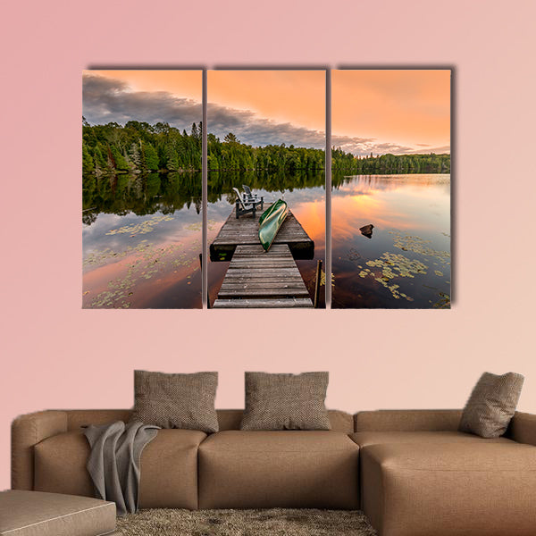 Green Canoe and Chairs on a Dock Next to a Lake at Sunset wall art