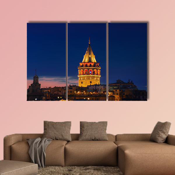 Illuminated Galata Tower in Istanbul, Turkey dark blue sky Multi panel canvas wall art