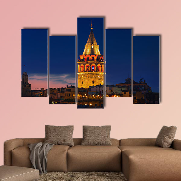Illuminated Galata Tower in Istanbul, Turkey dark blue sky Multi panel canvas wall art
