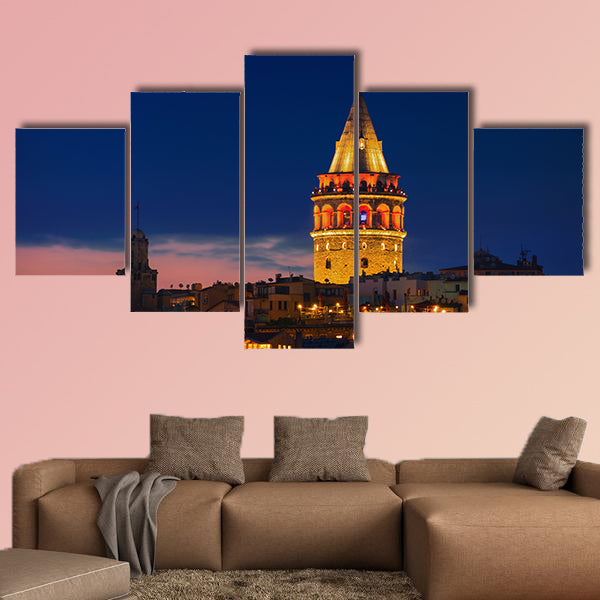 Illuminated Galata Tower in Istanbul, Turkey dark blue sky Multi panel canvas wall art