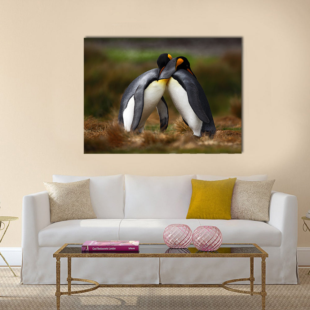 King penguin couple cuddling in wild nature with green background multi Panel Canvas wall Art