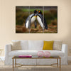 King penguin couple cuddling in wild nature with green background multi Panel Canvas wall Art