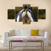 King penguin couple cuddling in wild nature with green background multi Panel Canvas wall Art